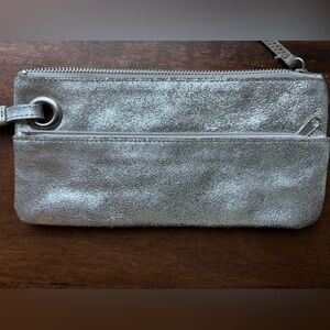Silver leather wristlet with zebra pattern interior